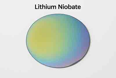 Lithium niobate (LiNbO₃) wafer with iridescent surface and flat edge