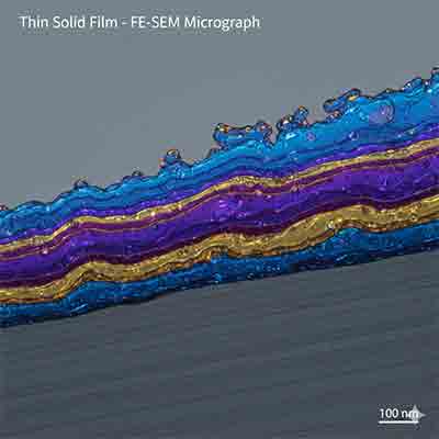 It offers a clear, high-level label for the image that appears when a user hovers over it, reinforcing the brand and the primary keyword. Cross-section FE-SEM micrograph showing multi-layered thin solid film deposition on a silicon substrate at 100nm scale